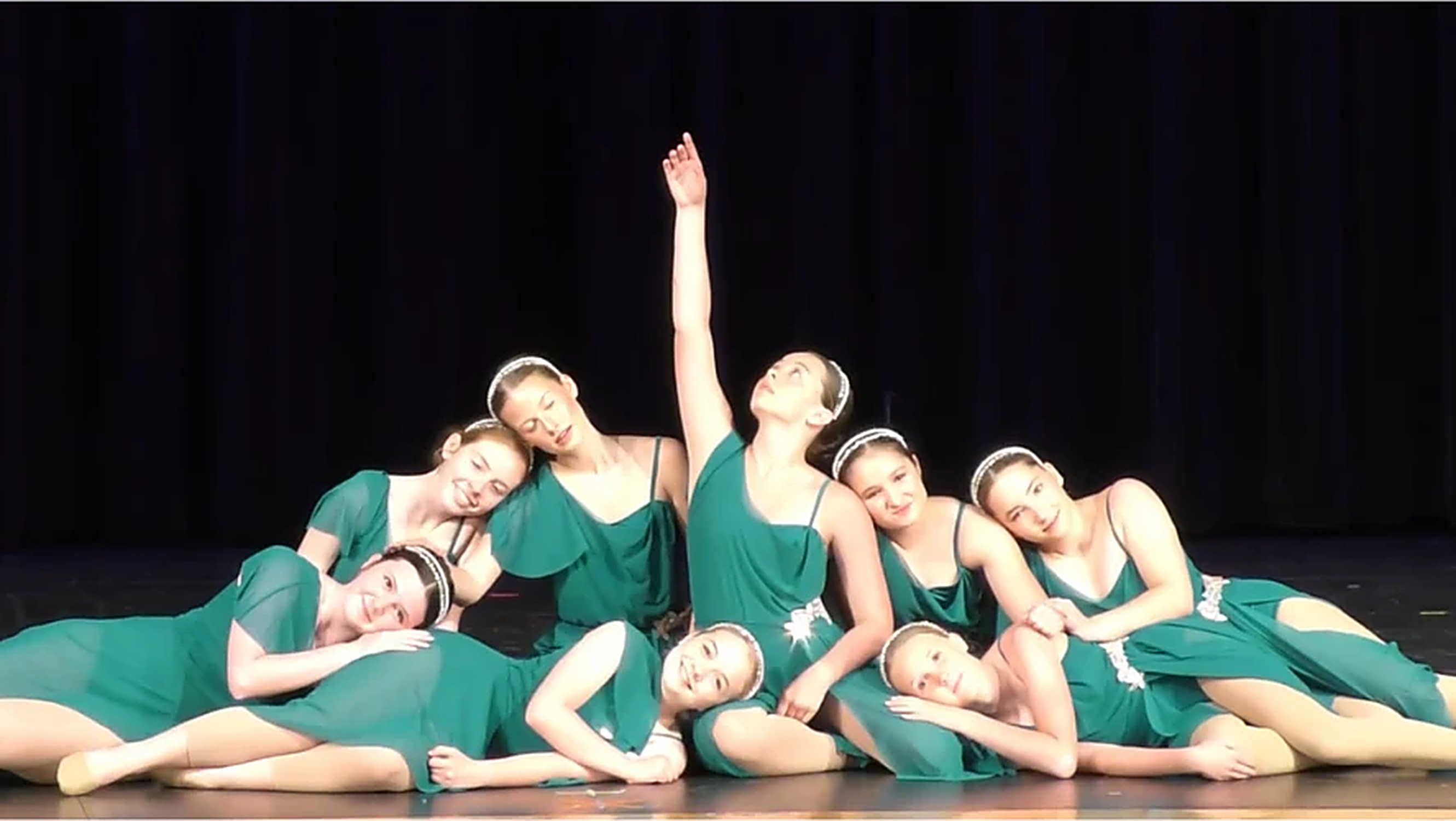 Grace in Motion dancers performing together on stage